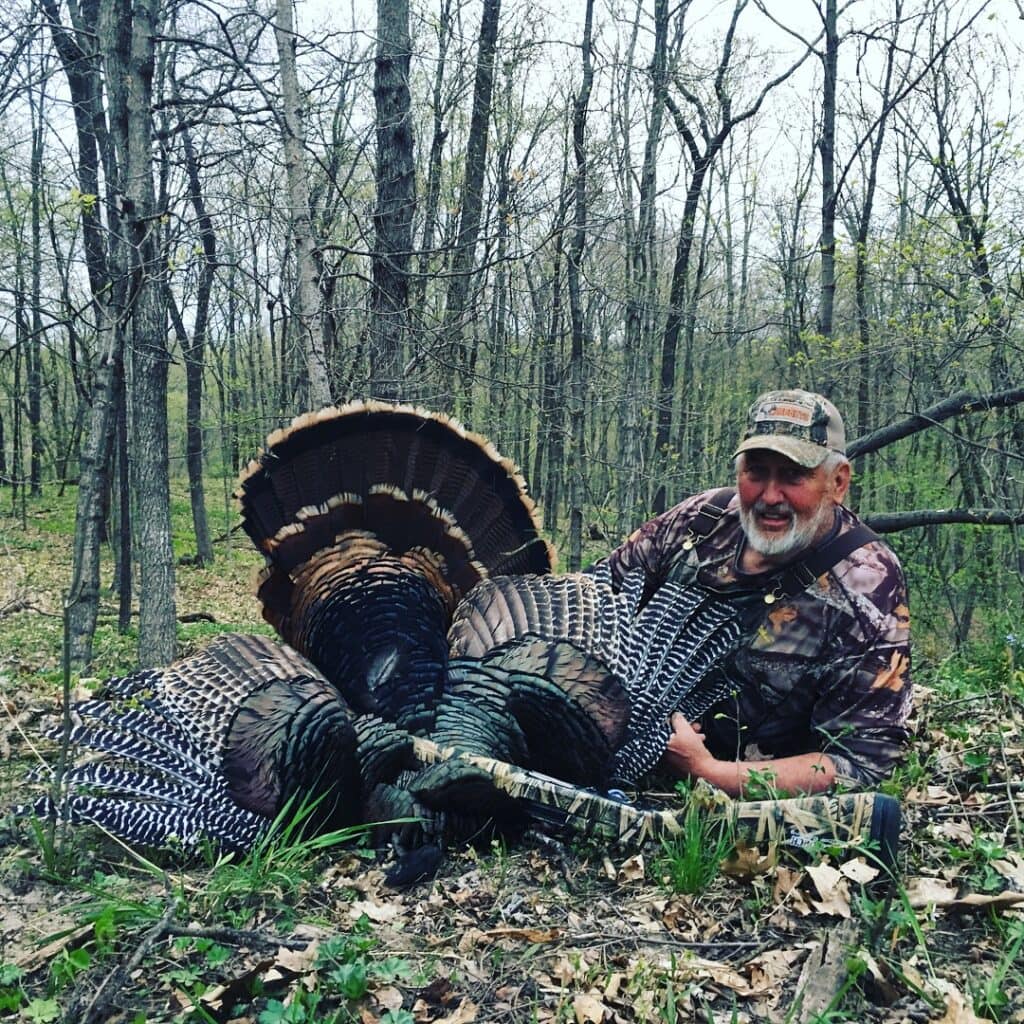 Matt's dad with a turkey he harvested on the very ridge this story took place on.