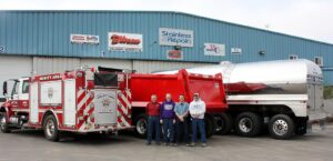 Derrick Backaus with family at family business in Wisconsin